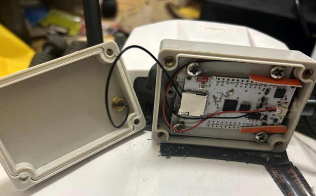 The HC33 and antenna assembled inside the project box